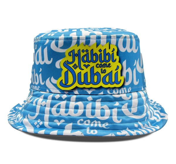 Habibi Come to Dubai Bucket Hat in blue featuring playful embroidered text for trendy streetwear style.